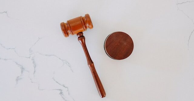 wooden gavel and mat